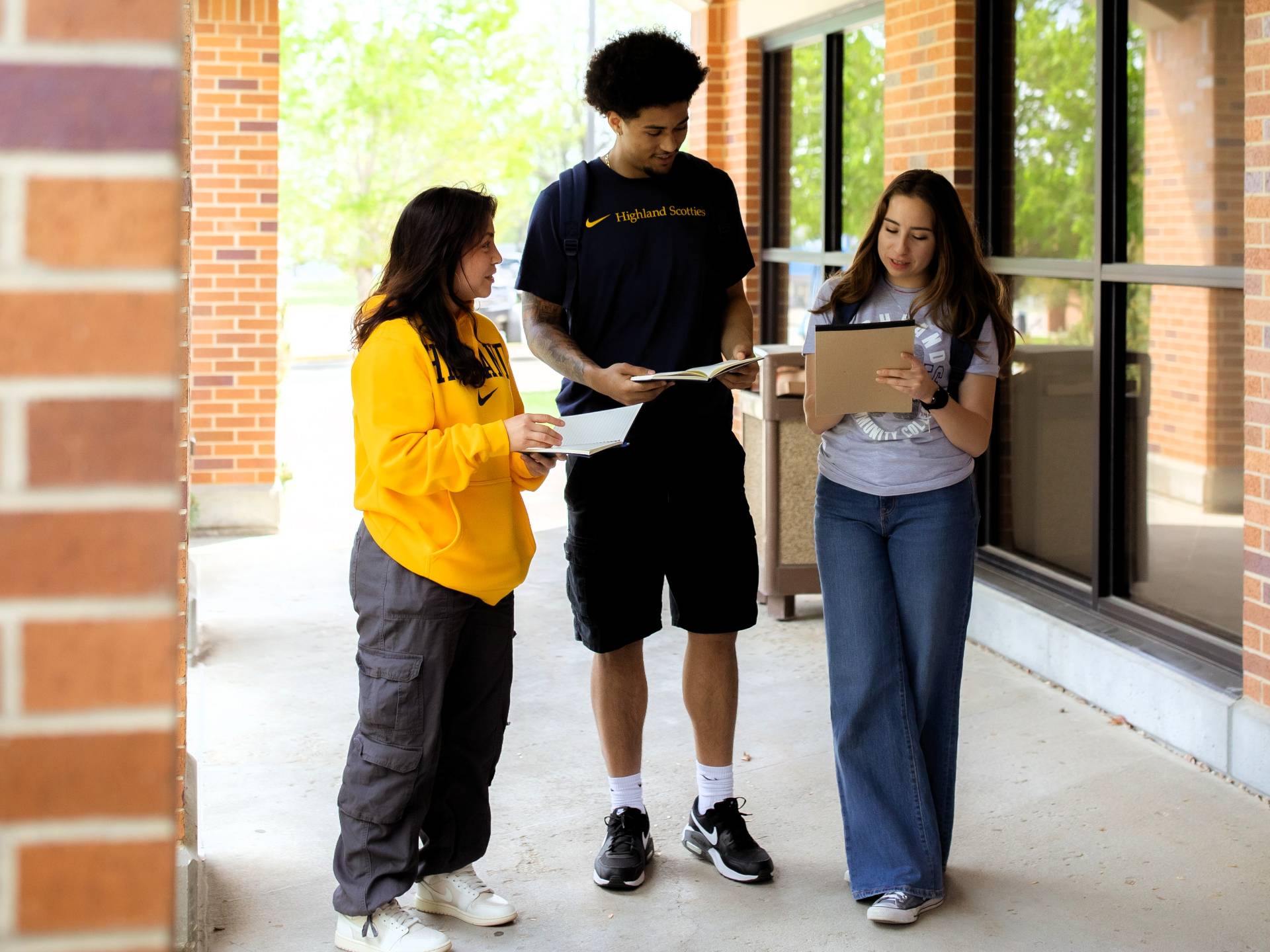 Students in science lab room, two students are reviewing a flyer together