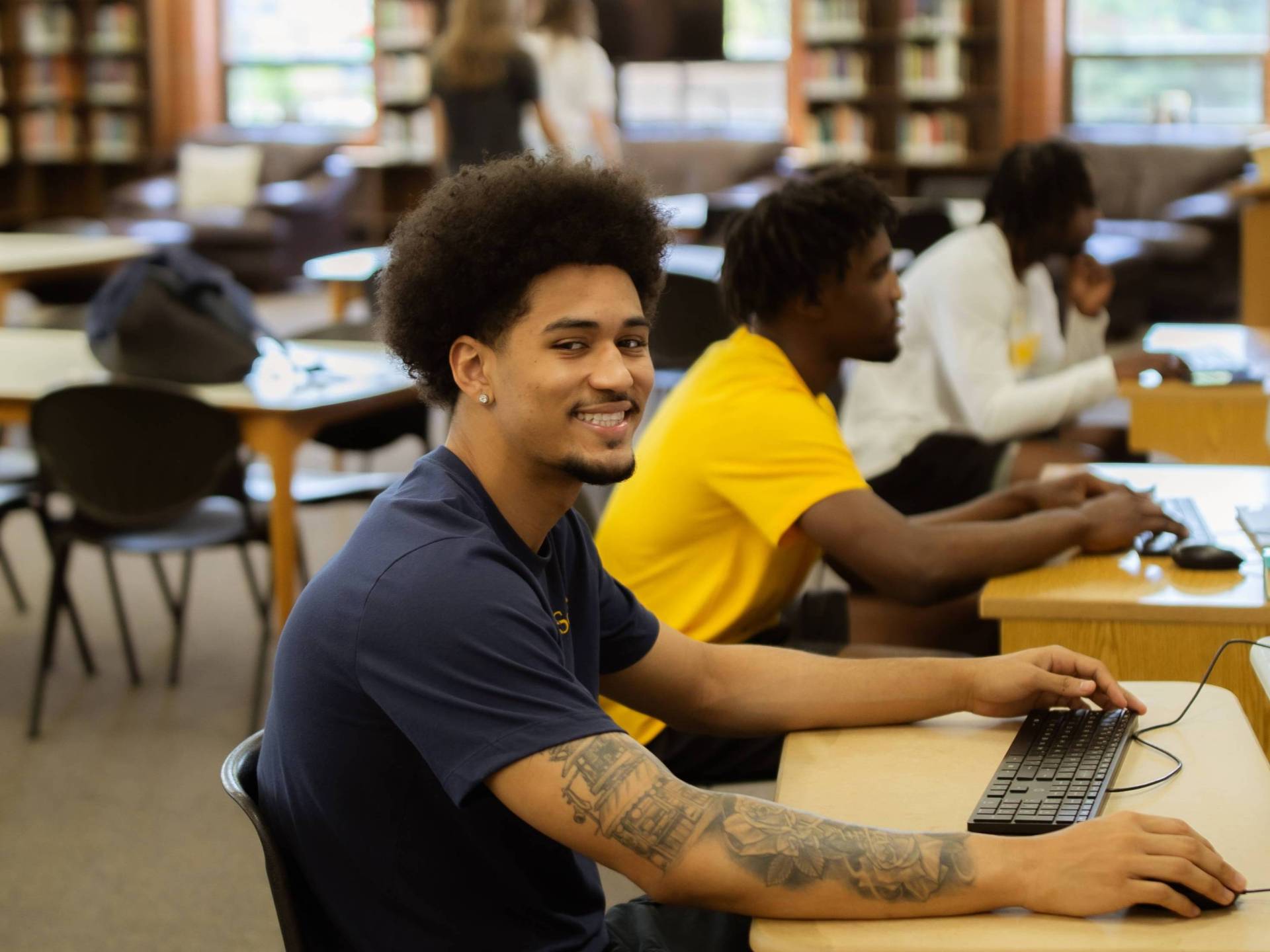 Student using a computer in the library