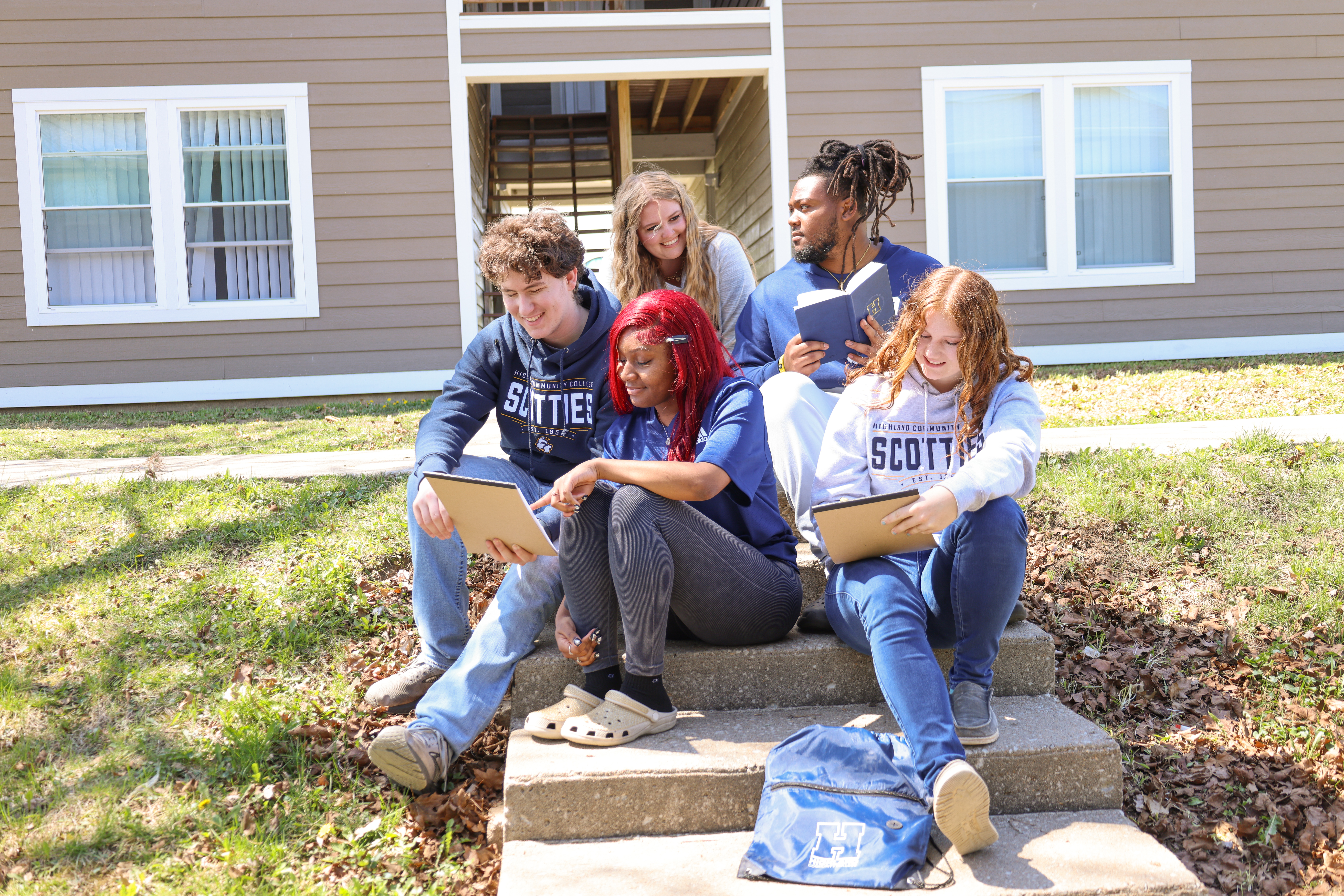 Group of students sitting on steps