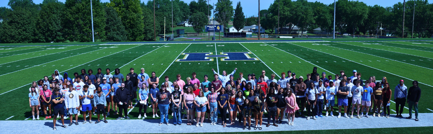 Student group photo on the football field